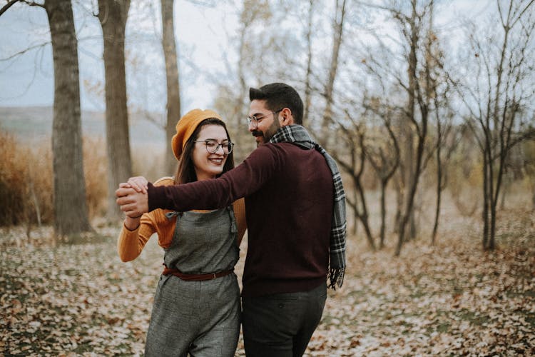 Young Couple Dancing In Forest