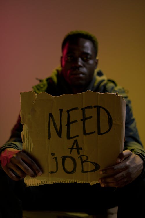 Free Workless man holding cardboard Stock Photo