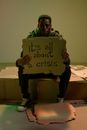 Workless man holding cardboard