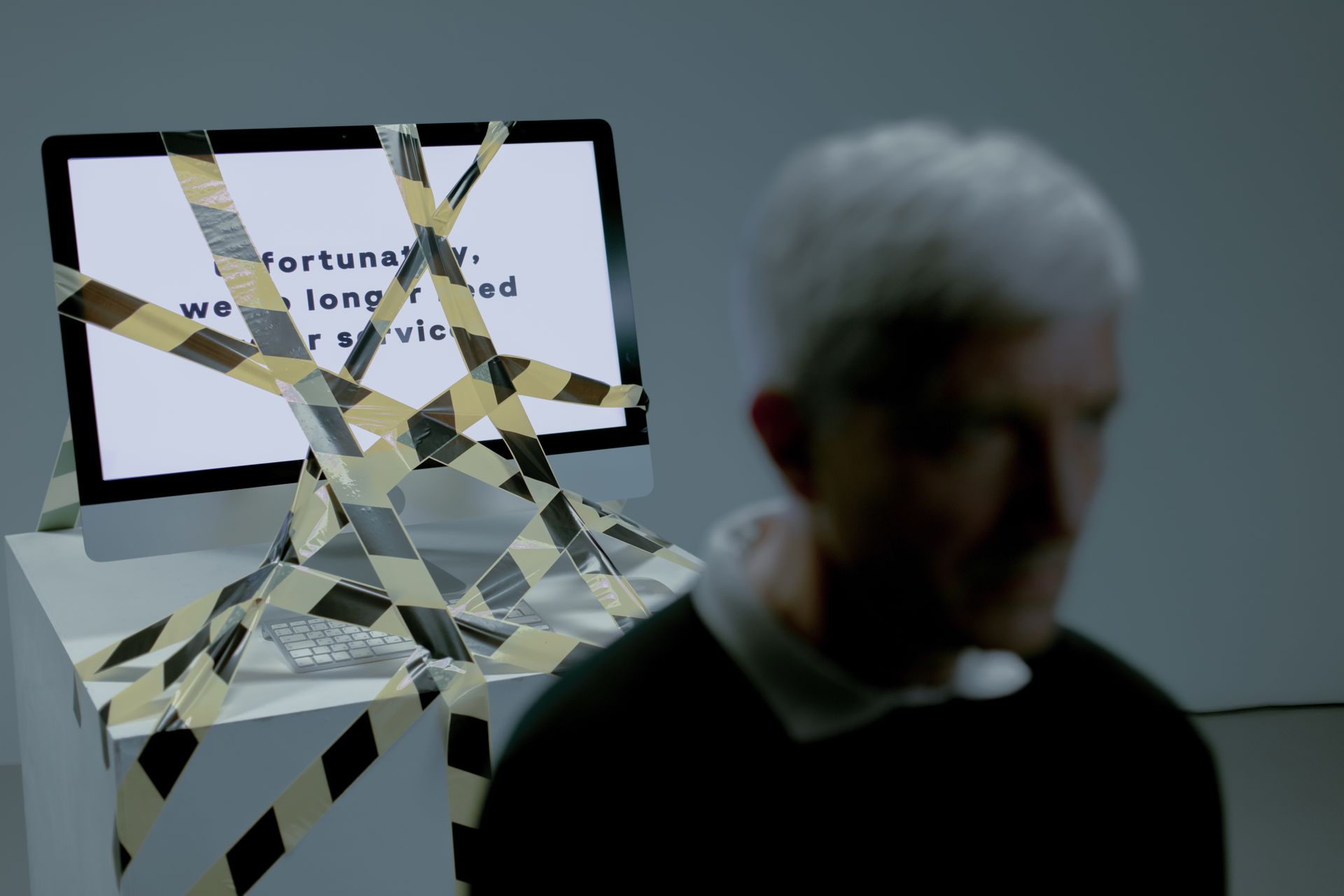 Computer tied with black and yellow tape