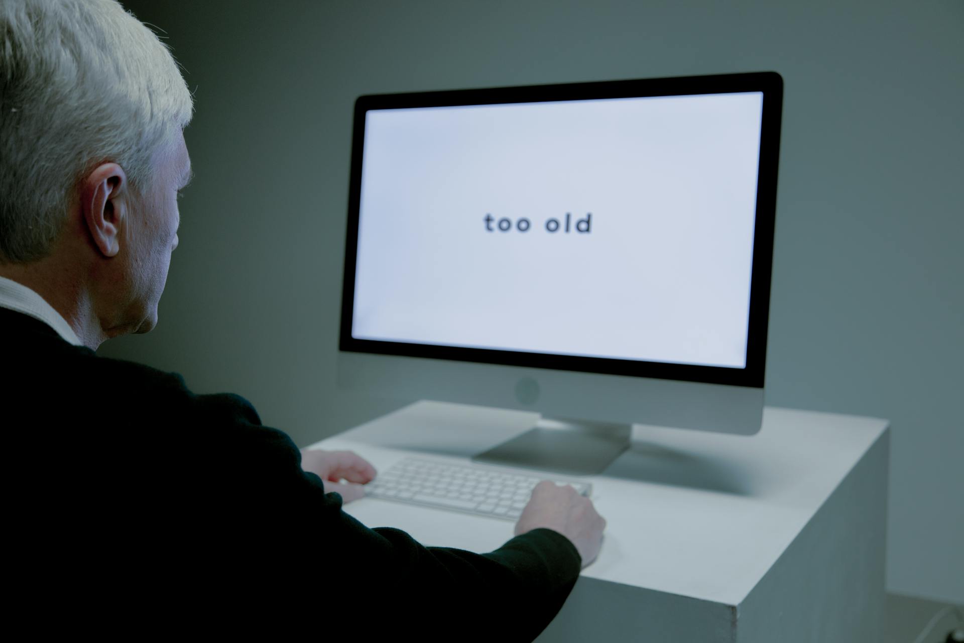 An Elderly Man Looking at the Computer Screen