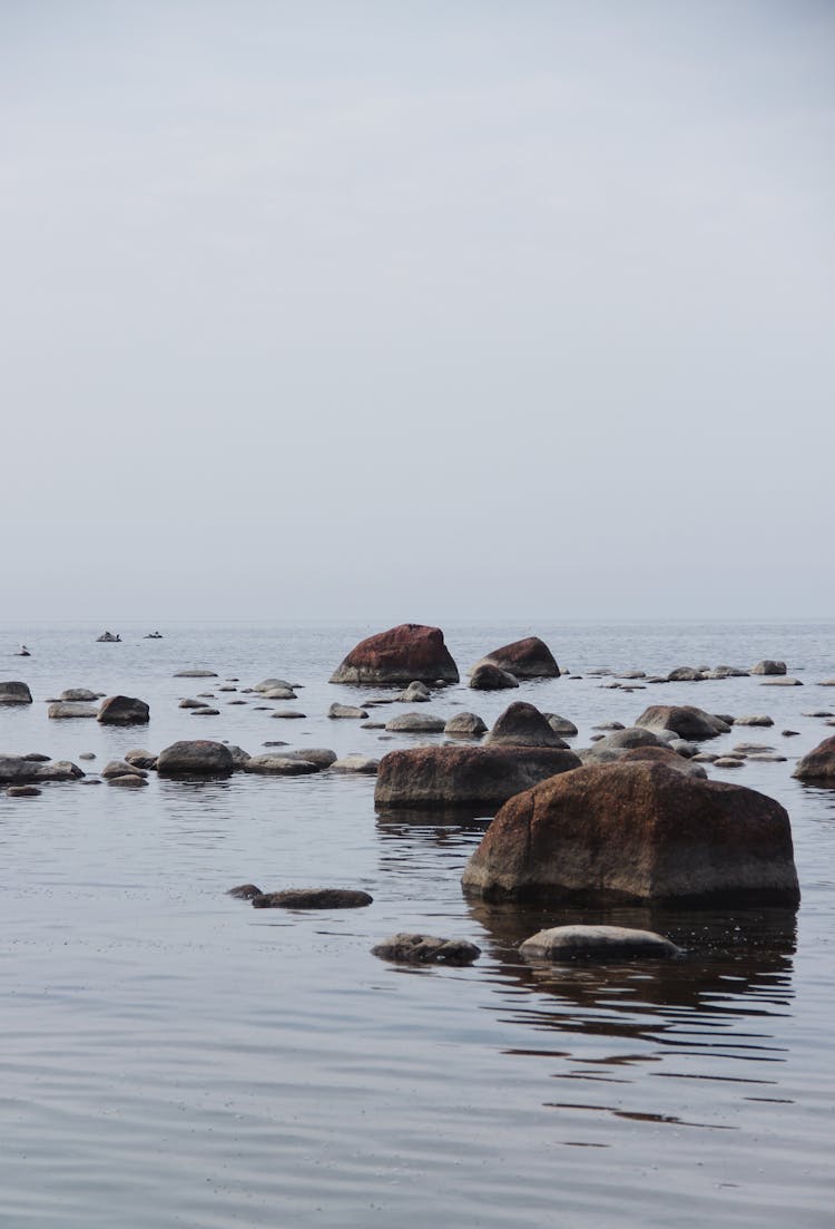 Big Boulders In Water At Sea Shore