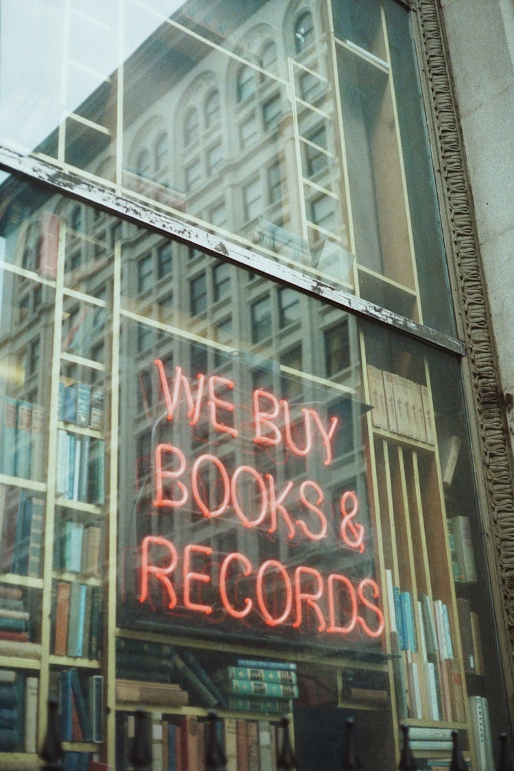 Neon Advertisement On Library Glass Wall