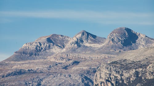 Free Gray Rock Mountains Under Blue Sky Stock Photo