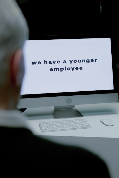 Free Man with gray hair losing job because of age Stock Photo