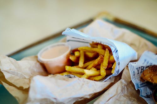 Free French Fries on White Paper Stock Photo