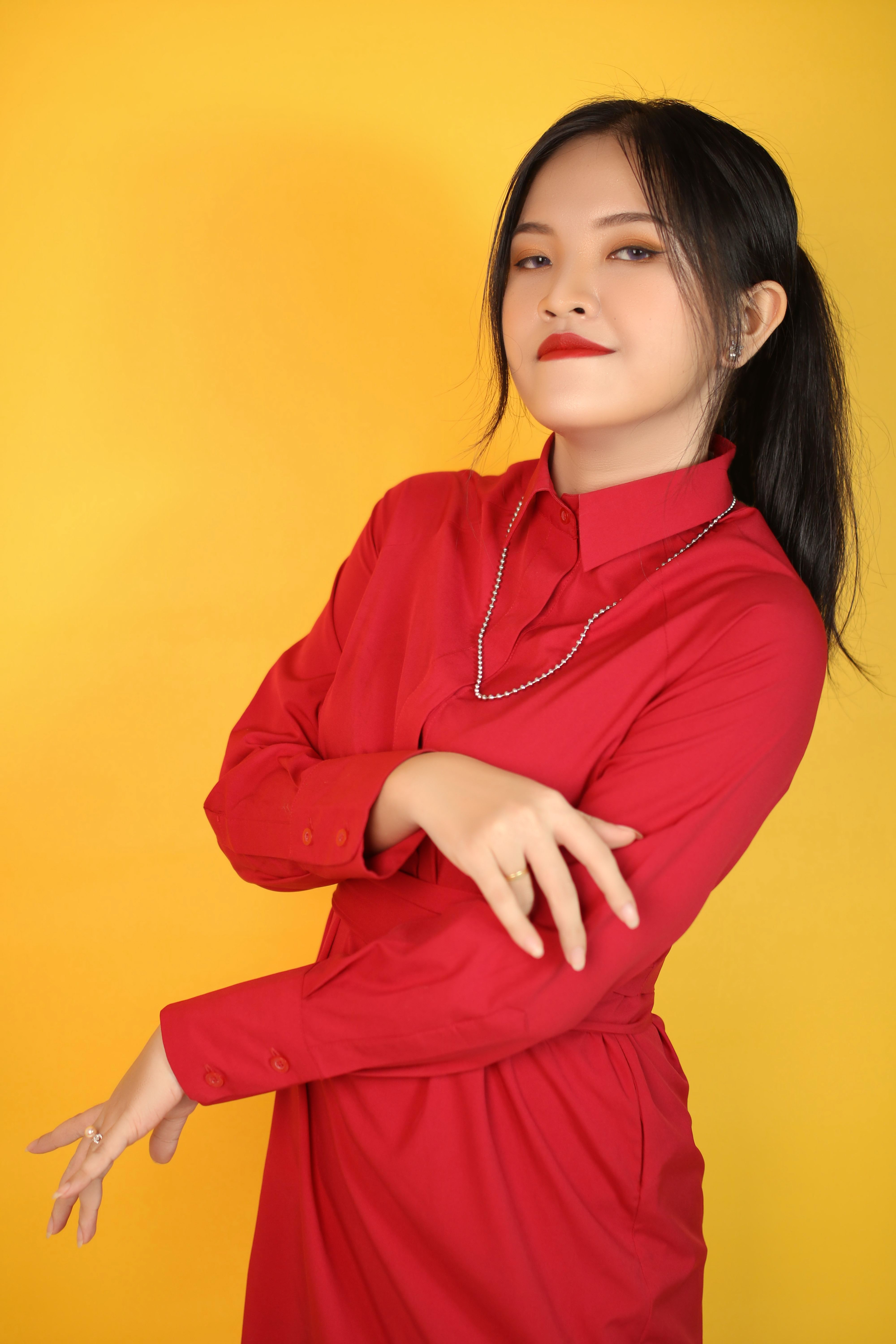 A Girl in Red Dress Smiling at the Camera · Free Stock Photo