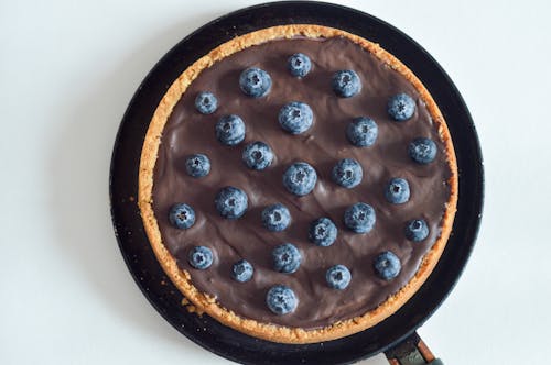 Free A Chocolate Pie with Blueberries on Top Stock Photo