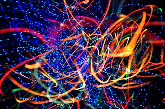 Colorful neon light streaks creating vibrant abstract patterns. Perfect for artistic backgrounds and designs.