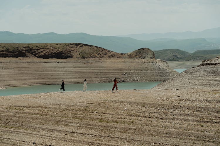 People Walking On The Shore