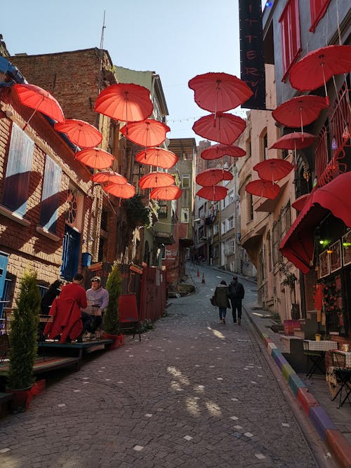 Red Umbrellas over Street