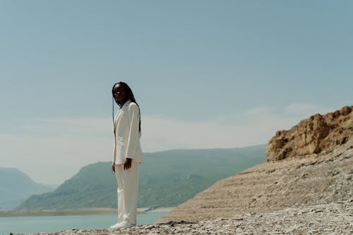 Woman in White Suit in Low Angle Shot 