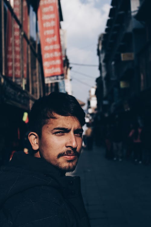 Selective Focus Photography of Man Wearing Black Top