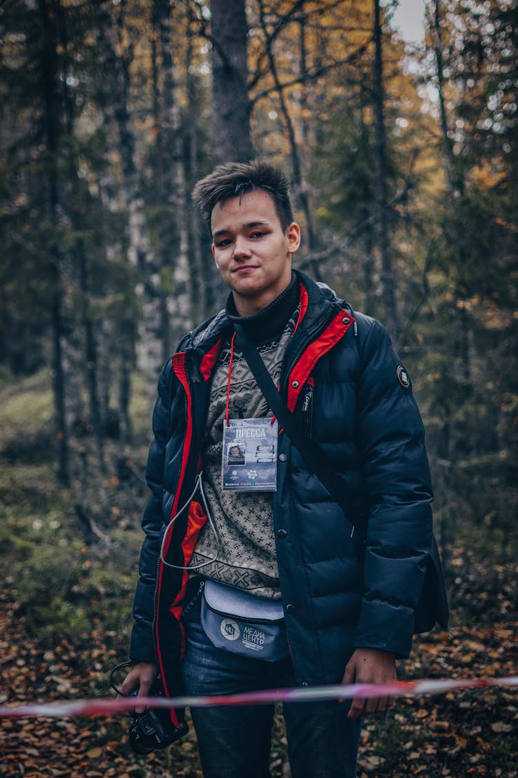 Man Standing In Forest