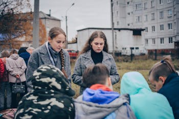 Women Interviewing Group of Teenagers