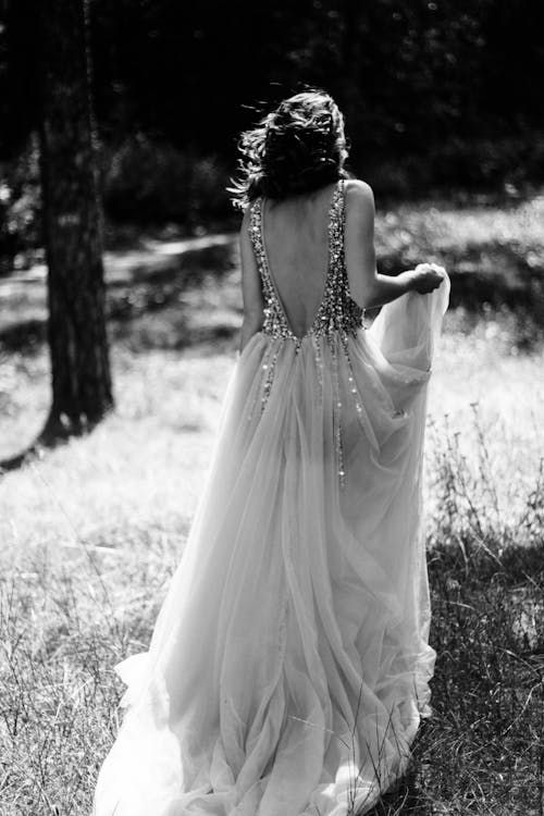 Woman in Dress on Grassland