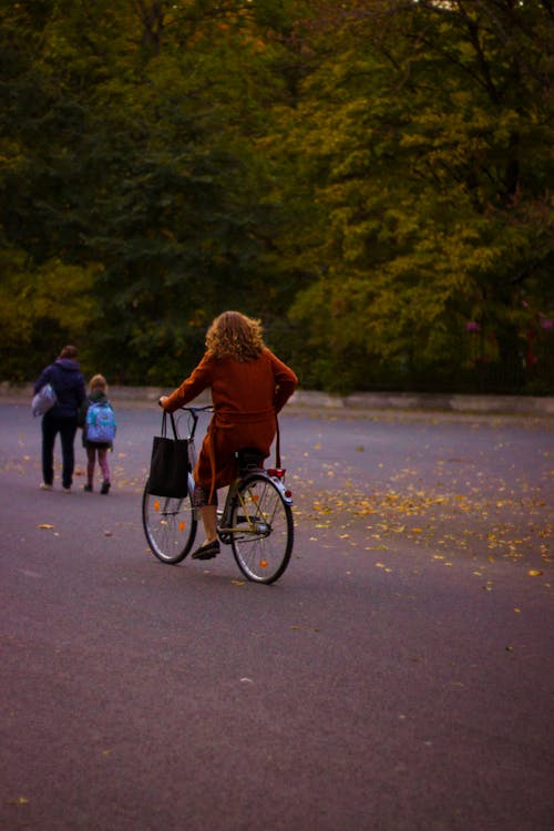 Free Woman on Bicycle in Park Stock Photo