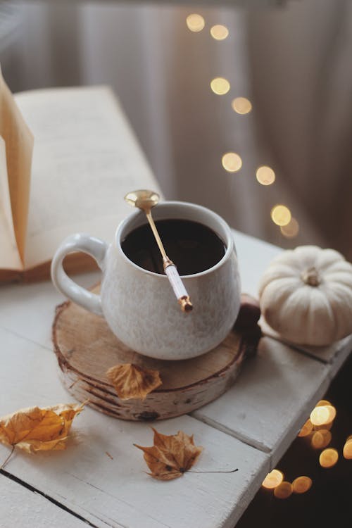 Coffee in Cup in Autumn Cozy Decoration