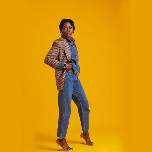 Free A Woman Wearing Denim Clothes with a Plaid Jacket
 Stock Photo