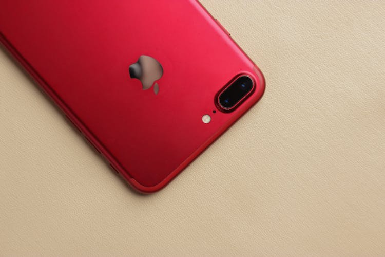 A Red IPhone With Dual Camera