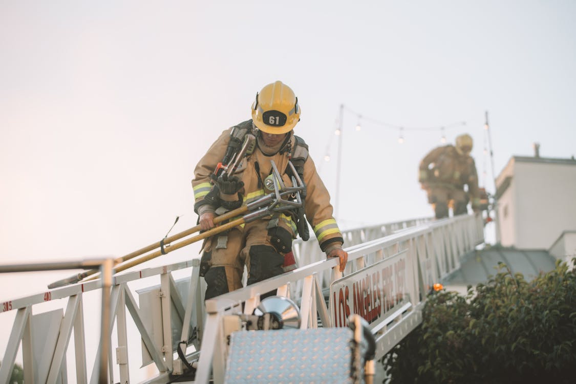 Free Firefighters on ladder Stock Photo