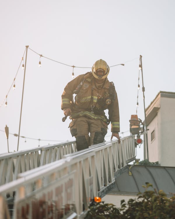 Firefighter climbing down the ladder