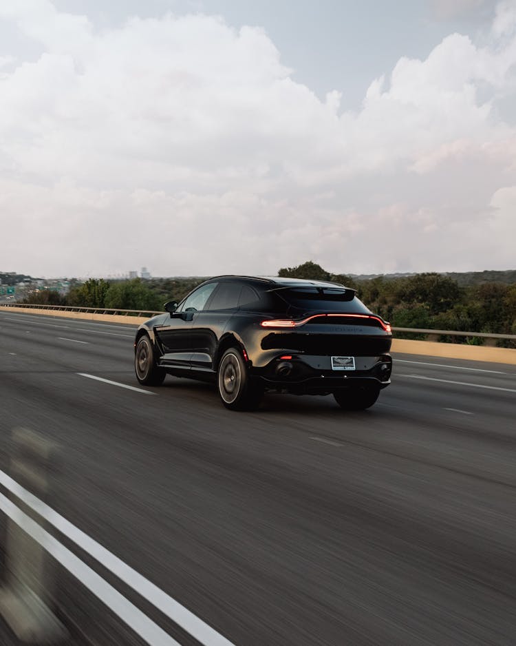 A Black Suv Speeding On Road