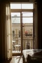 View of old building from room interior through balcony door