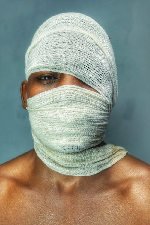 Person with Bandage on His Face 