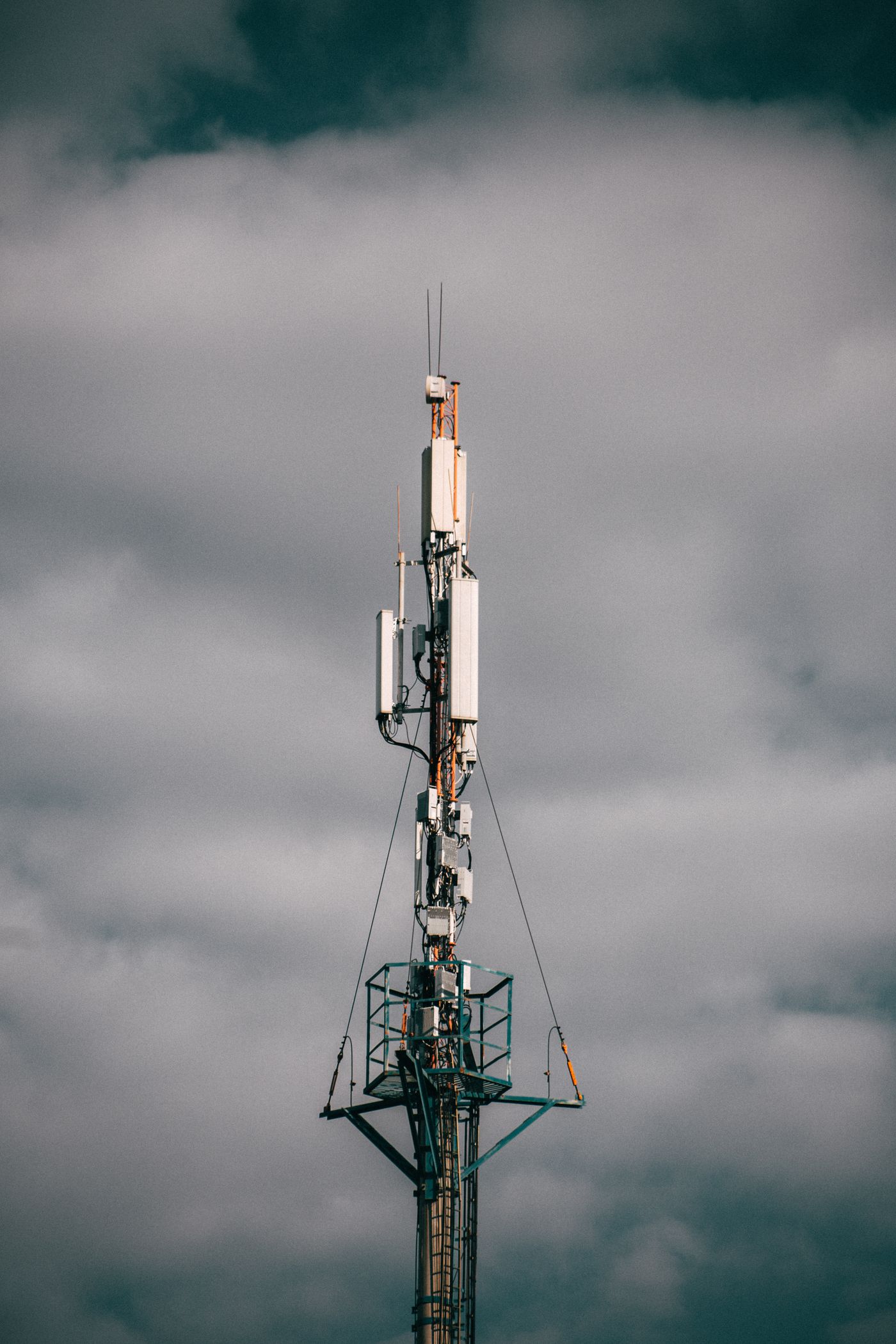 Tall broadcast tower against an overcast sky