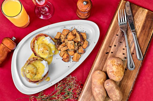 Free A Plate of Delicious Creamy Baked Potatoes Stock Photo