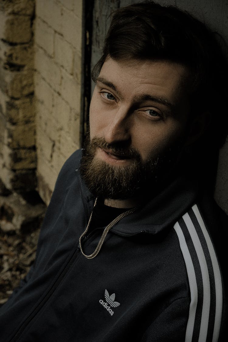 Man In Adidas Zip Up Jacket Wearing A Gold Necklace