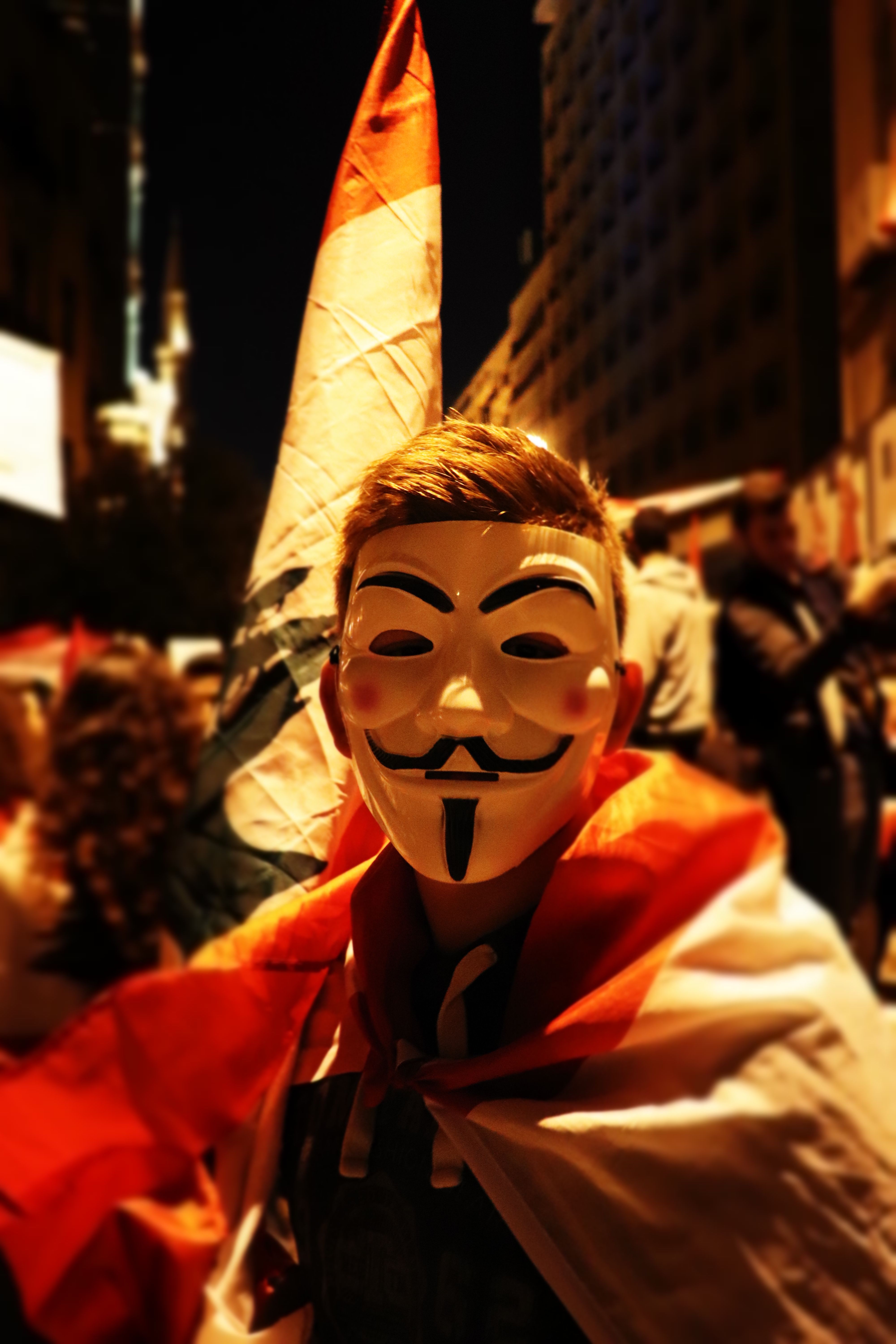 A Person in Pullover Hoodie in a Guy Fawkes Mask · Free Stock Photo