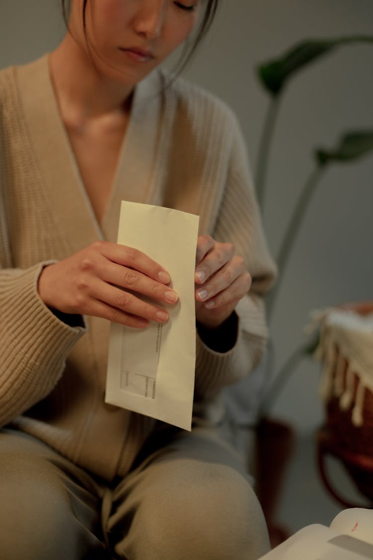 Close Up On Woman Holding Letter