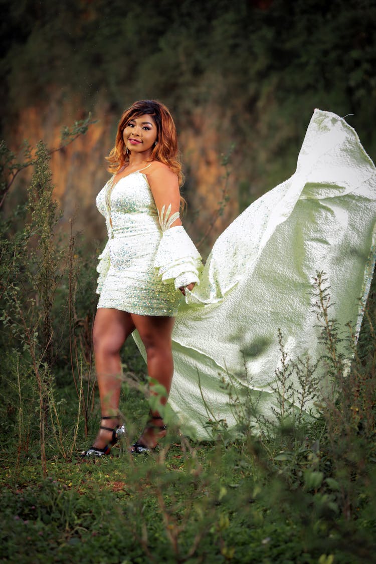 Woman In A A White Short With Long Trail 