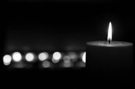 White Pillar Candle in Black Background