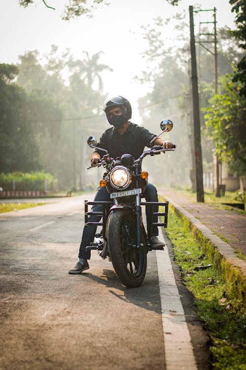 Free Man in Black Helmet Riding Motorcycle Stock Photo