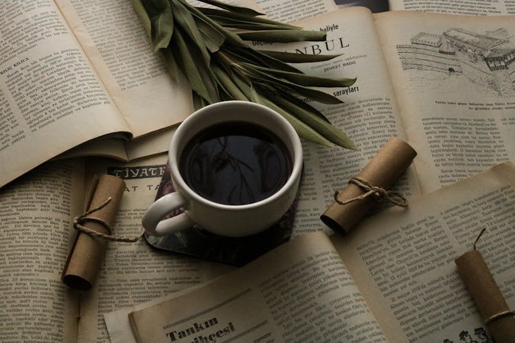 Coffee On Open Books Pages