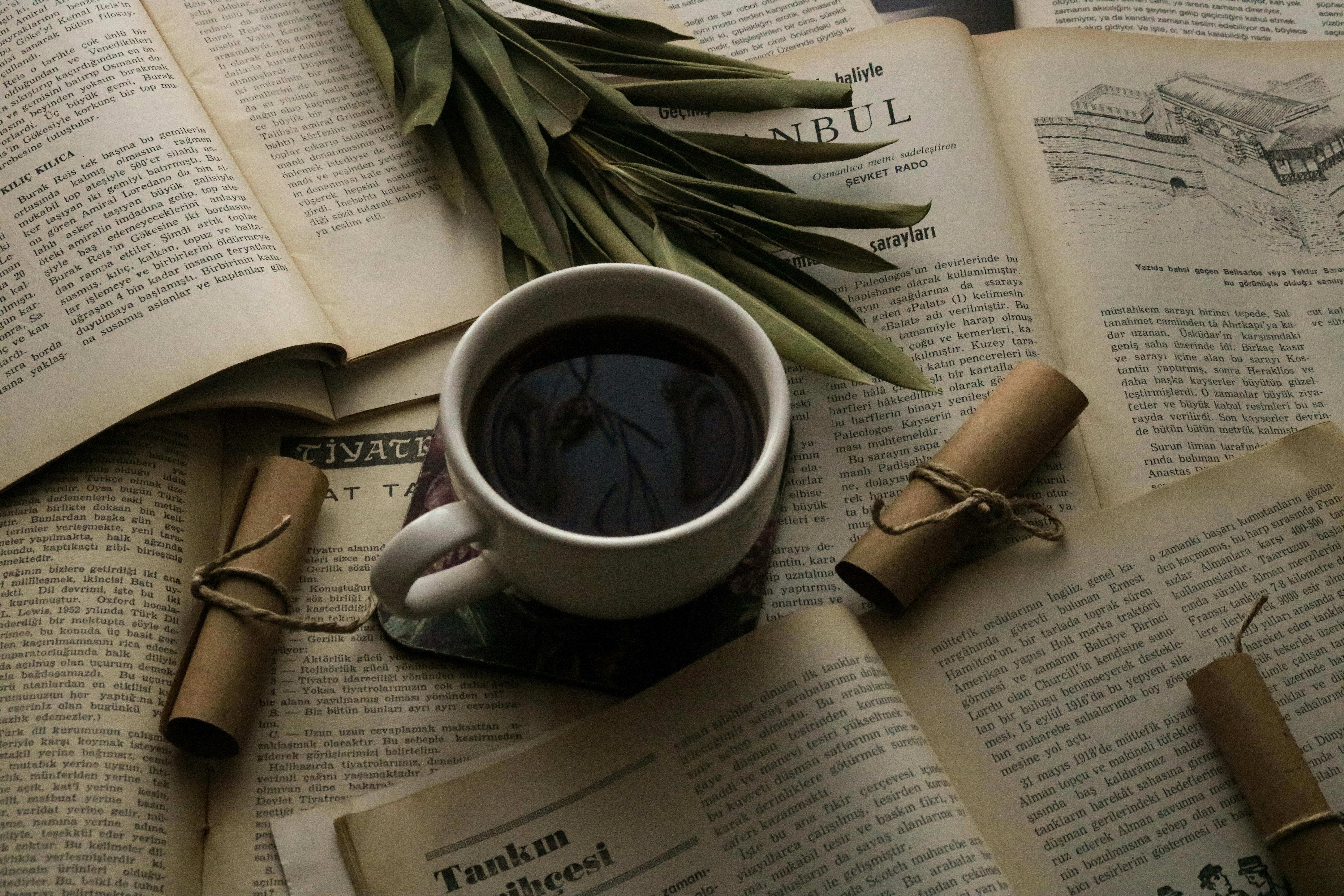 A Close-Up Shot of Books and a Cup of Coffee · Free Stock Photo