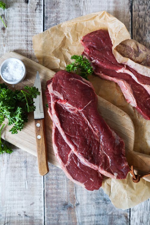 Sliced Meat on the Wooden Chopping Board