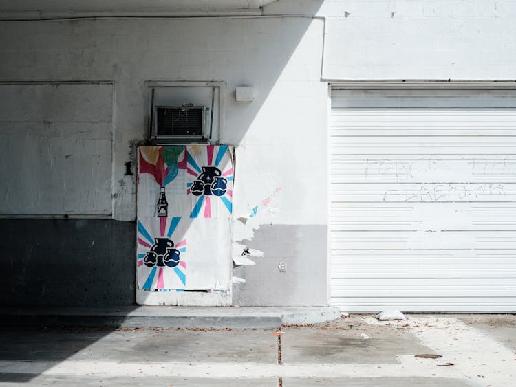 Posters On A Wall Of A Building