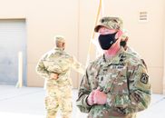 Man in Green and Beige Camouflage Uniform Wearing Black Goggles