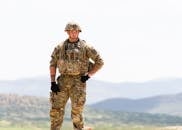 Unarmed US Soldier in Field Camo Uniform with Mountains in Background
