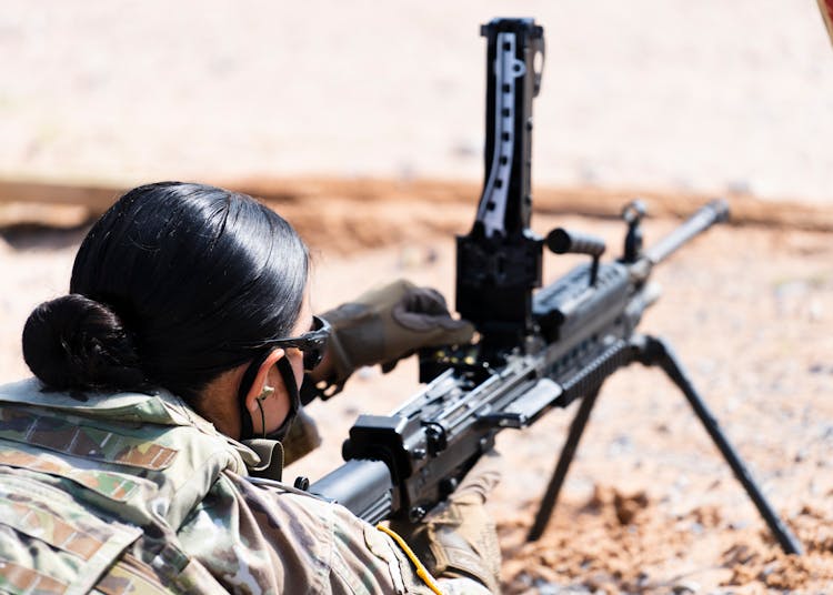 A Woman Using A Machine Gun 