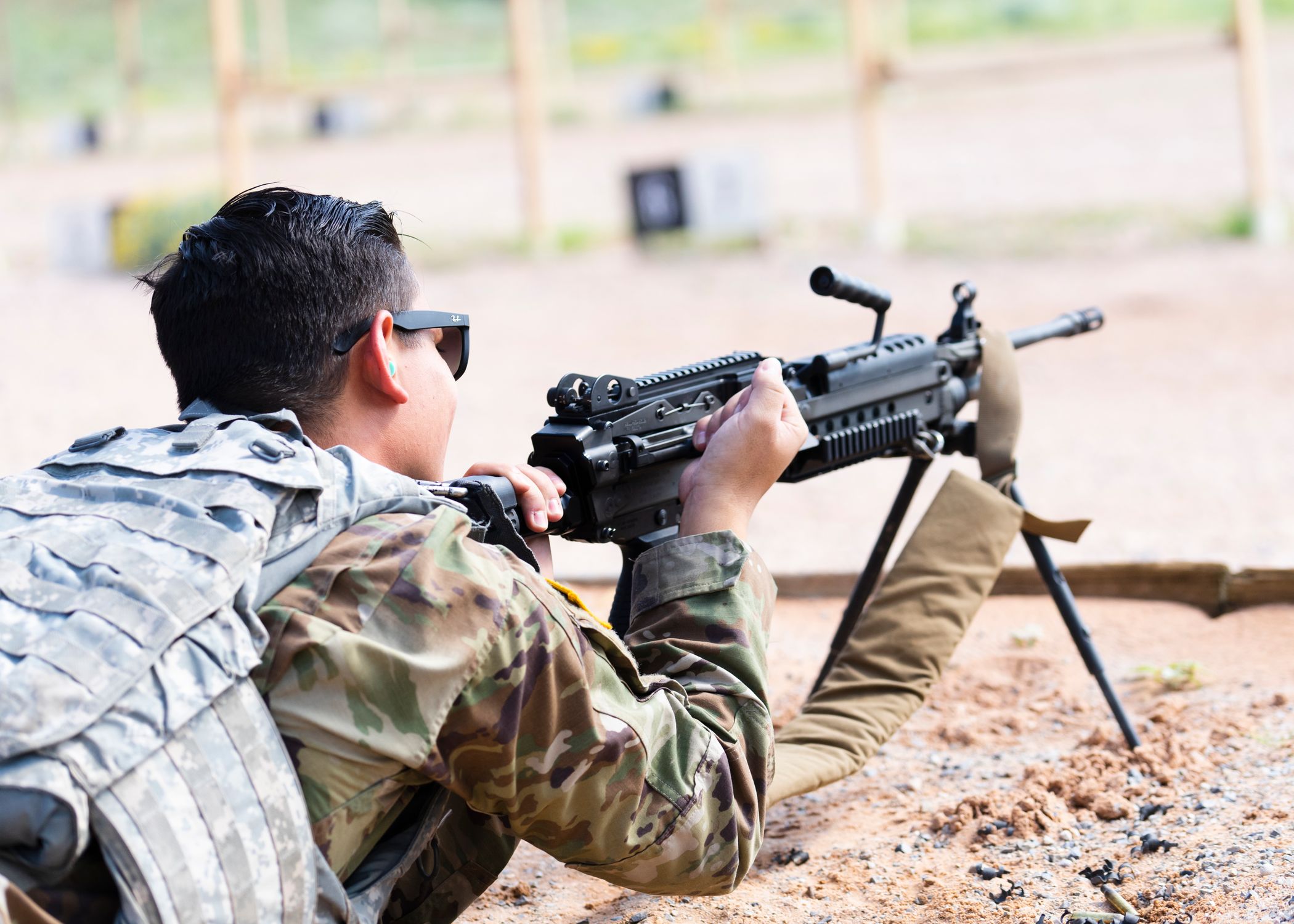 A Soldier Firing a Machine Gun · Free Stock Photo
