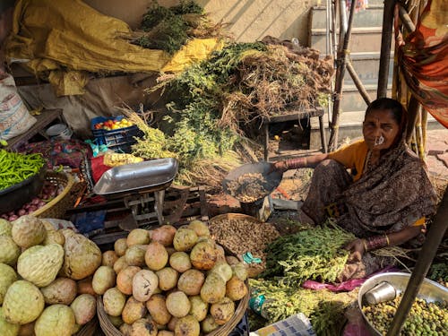 Free Woman Beside Vegetables On Baskets Stock Photo