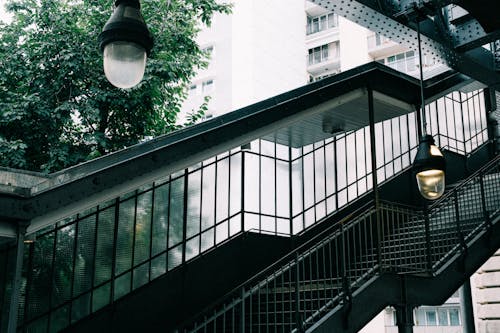 Concrete Staircase With Metal Railings Near Building