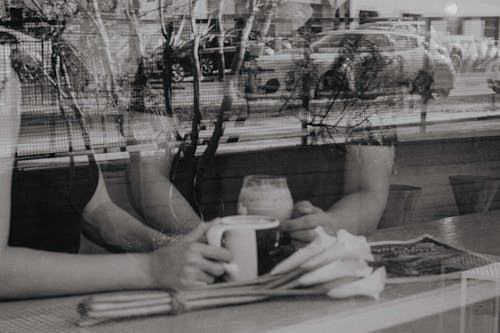 People Sitting Inside the Coffee Shop 