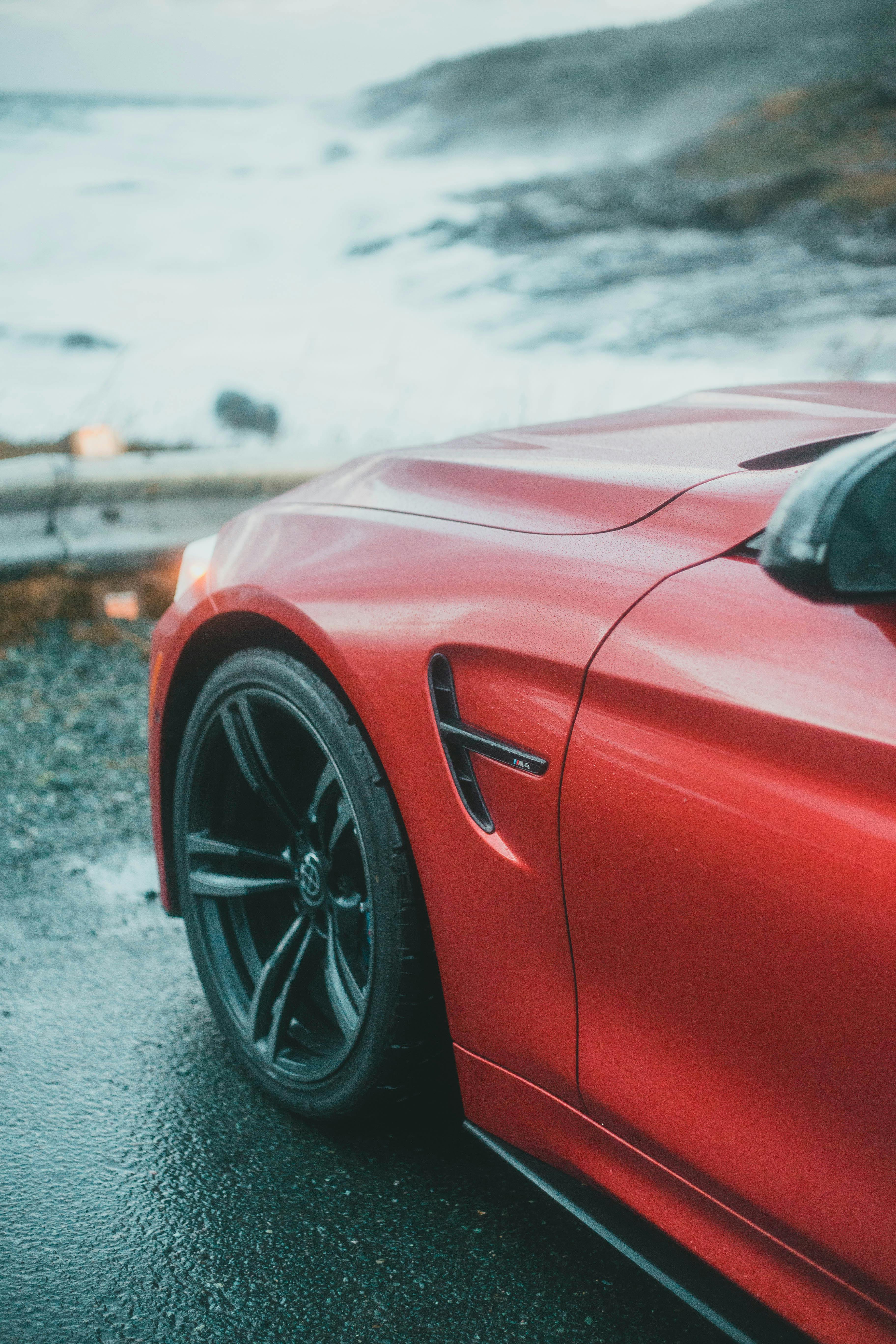 Side of Car Parked Near Coastline · Free Stock Photo