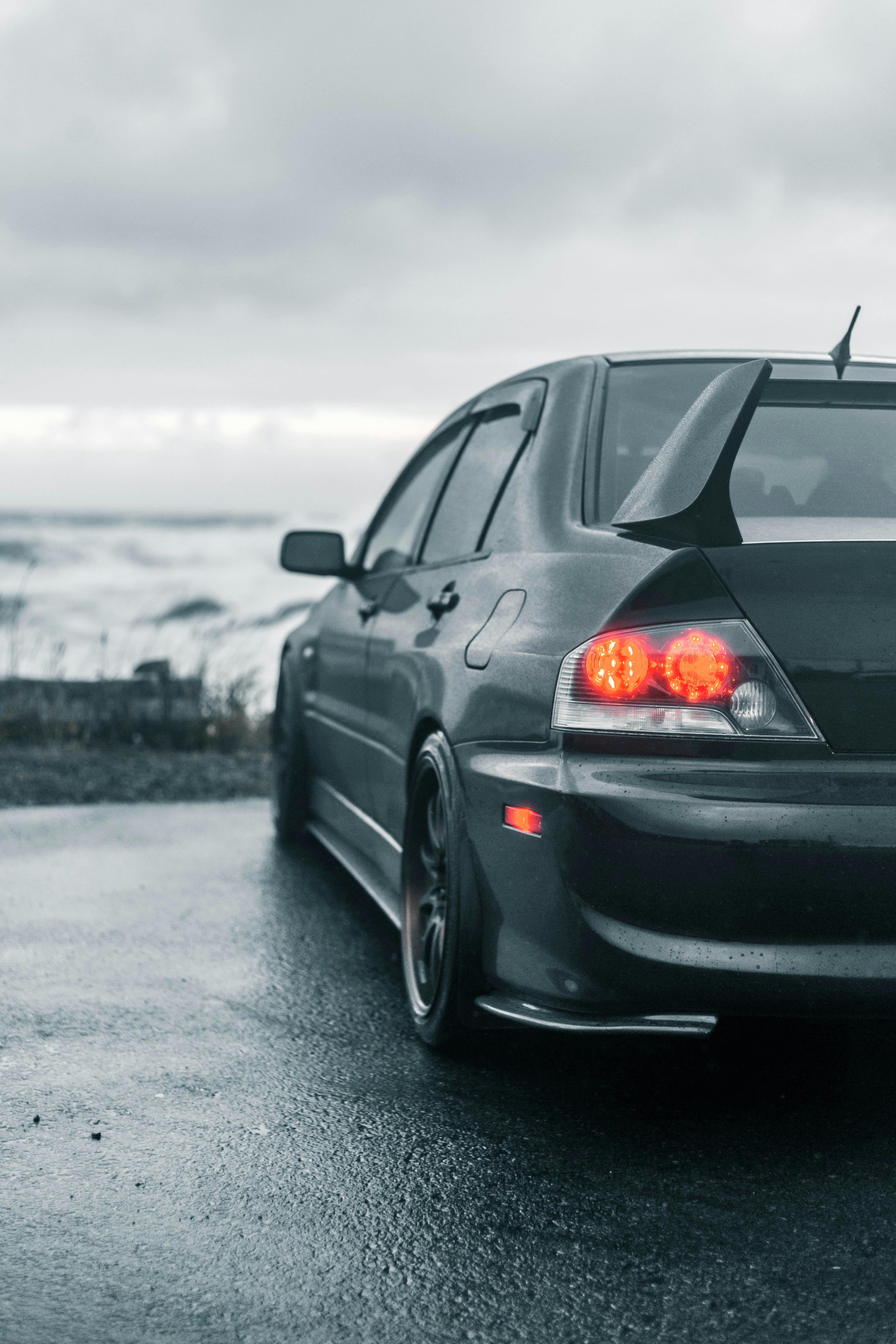 Mitsubishi Lancer Evolution Parked in a Garage · Free Stock Photo Mitsubishi Lancer Evolution Parked in a Garage · Free Stock Photo
